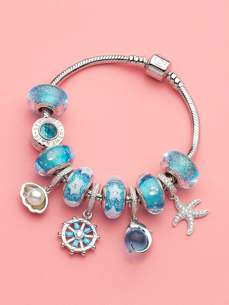 Ocean-inspired dolphin dangle charm bracelet styling