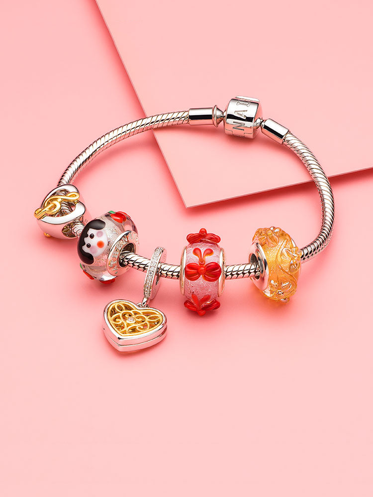 Filigree heart charm styled on European-style bracelet