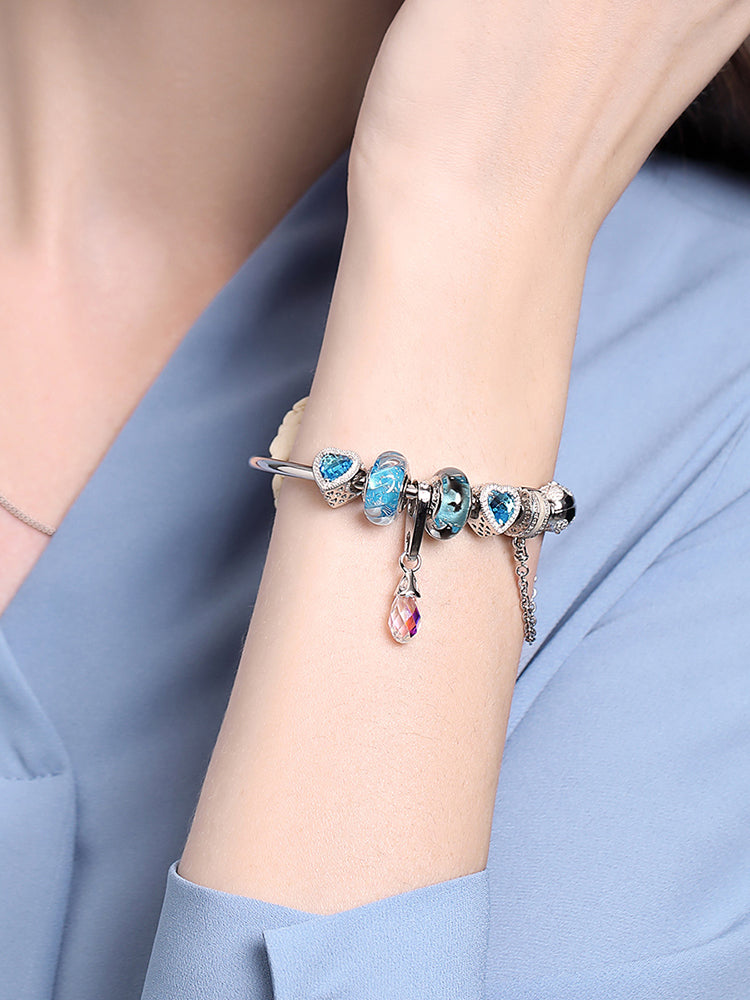 Aurora crystal dangle charm worn on bracelet