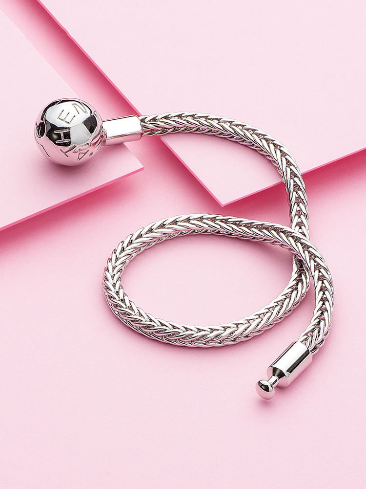 Wheat chain charm bracelet styled with silver charms