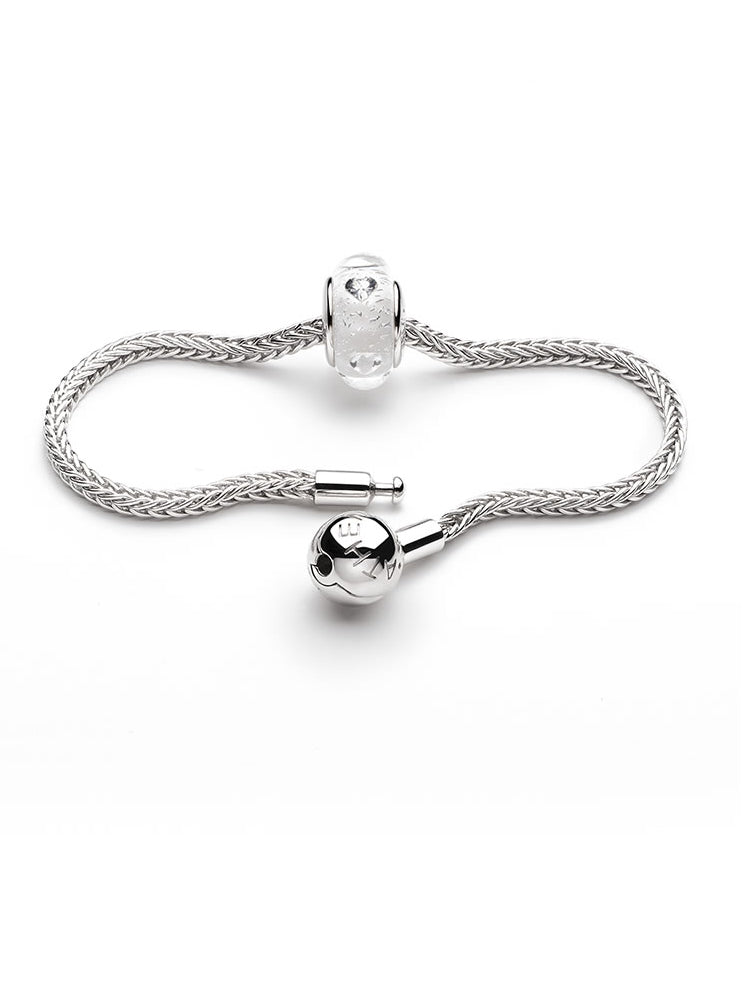 Wheat chain charm bracelet paired with decorative silver charms