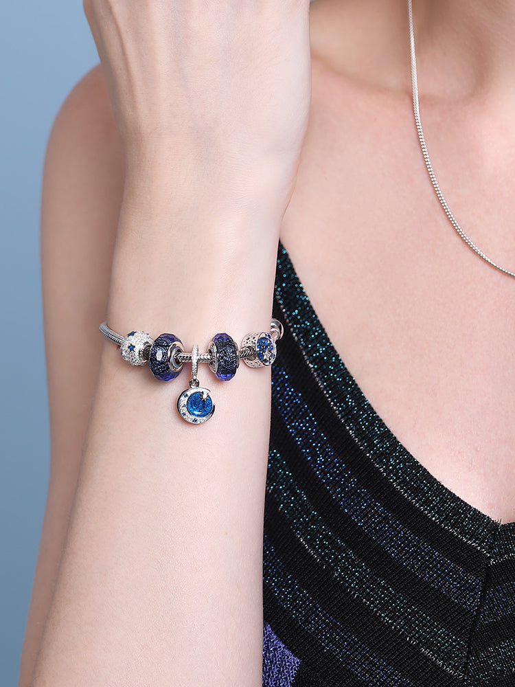 Model wearing blue starlight star charm bead bracelet