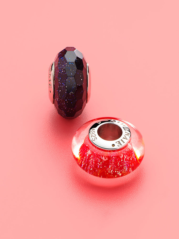 Stardust facets murano glass charm styled on sterling silver charm bracelet