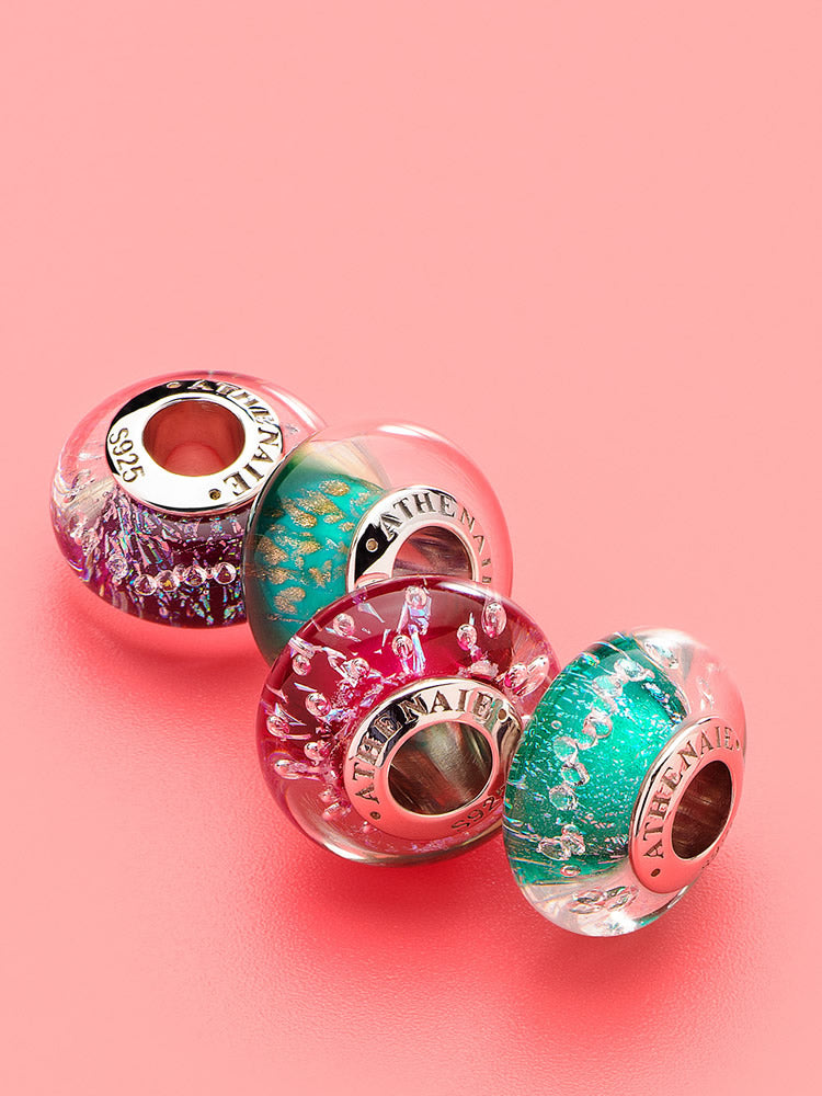 Stardust Murano glass charm bead with galaxy sparkle on bracelet by ATHENAIE