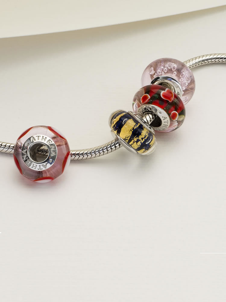 Starlit gold murano glass charm styled on sterling silver charm bracelet