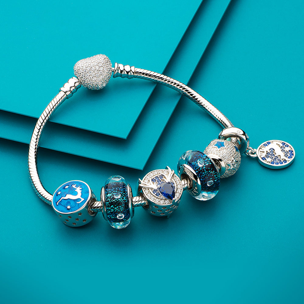 Starry Reindeer Christmas charm styled with ATHENAIE bracelet – elegant holiday jewelry idea