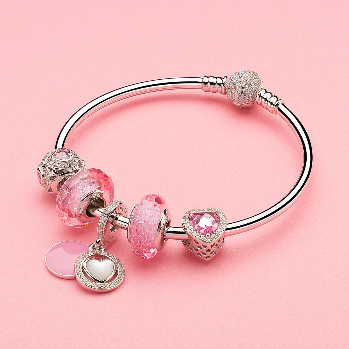 Sweetheart Glow charm styled on silver bracelet with mother-of-pearl accents