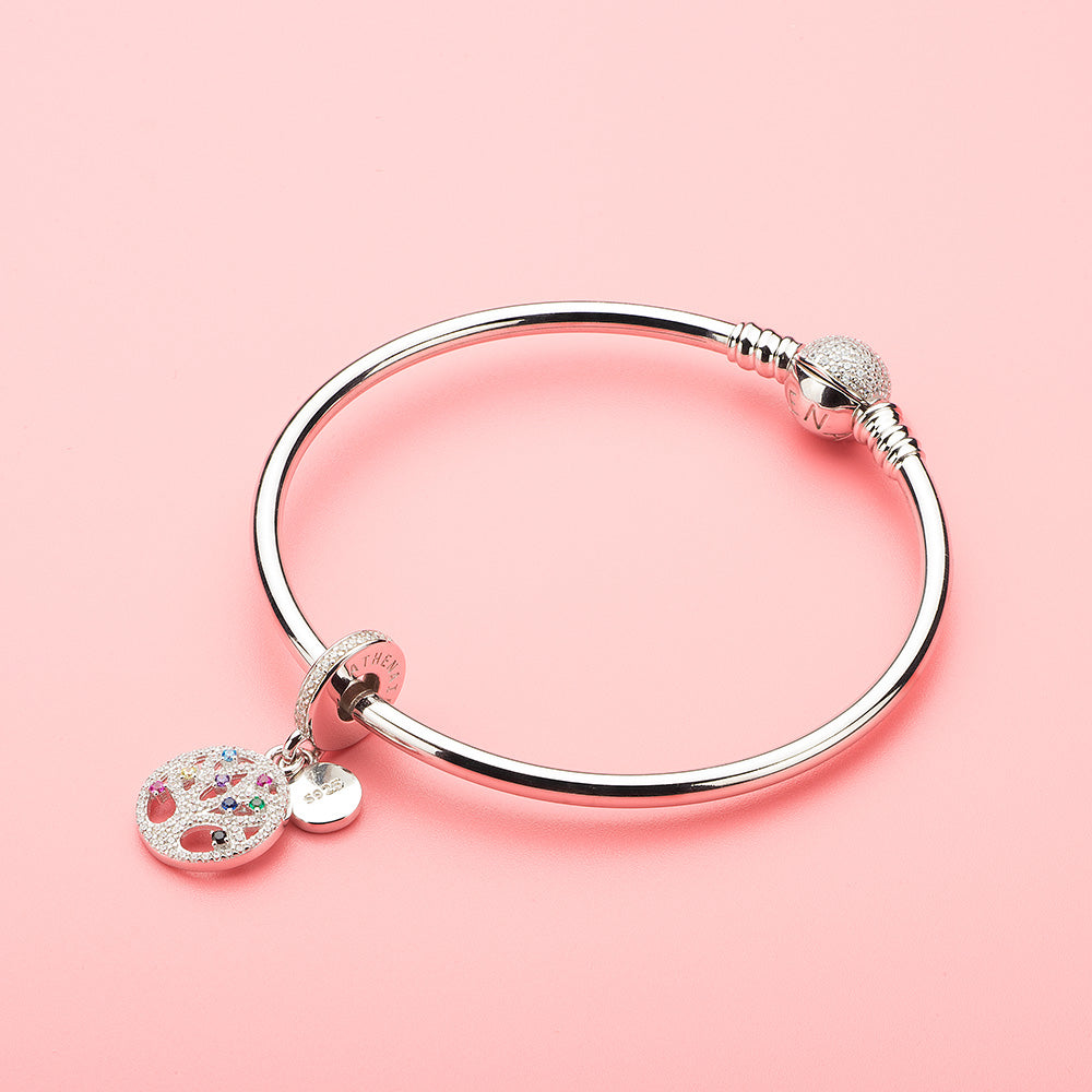 Tree of Life charm styled with silver beads on bangle, symbolic family jewelry piece
