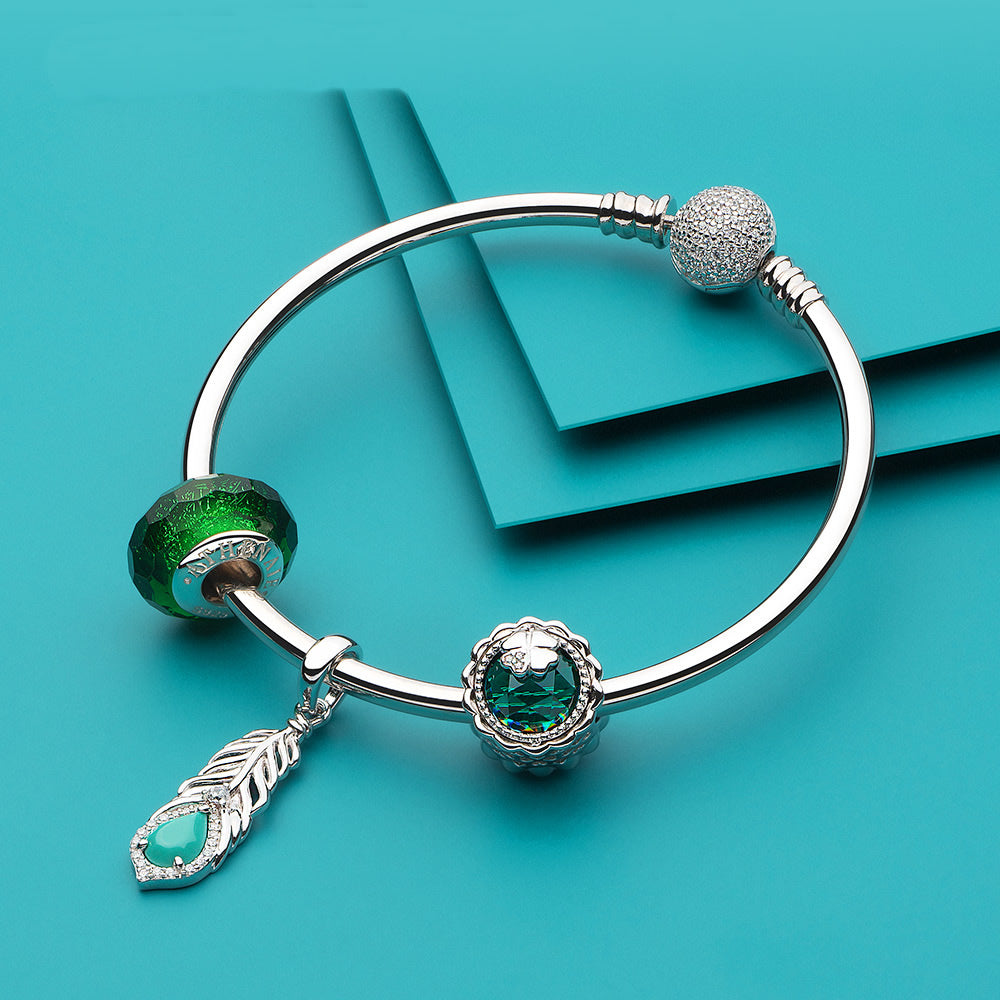 Turquoise Feather CZ pendant charm paired with European bracelet style.