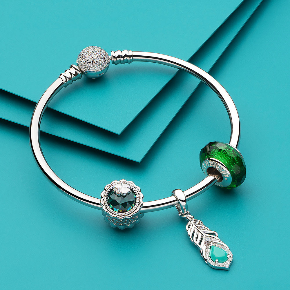 Turquoise Feather CZ pendant charm styled with silver bracelet combination.