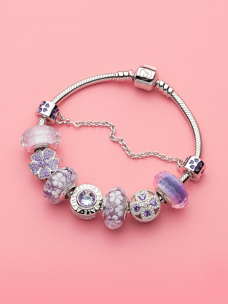 Twilight amethyst murano glass charm displayed on sterling silver bracelet