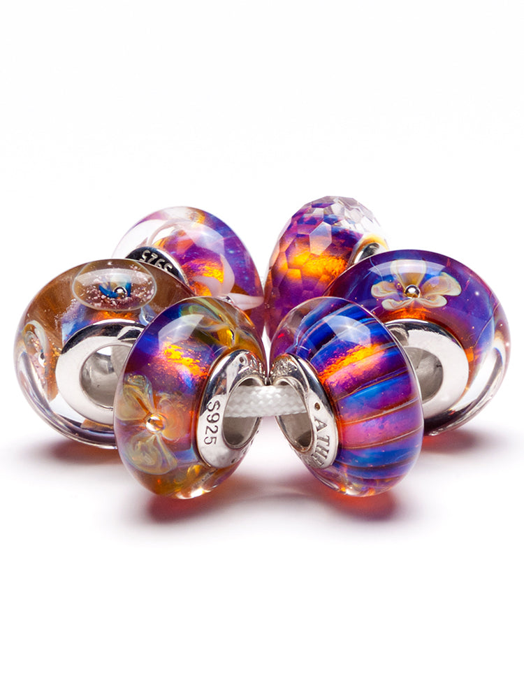Close view of twilight prism murano glass charm on sterling silver bracelet