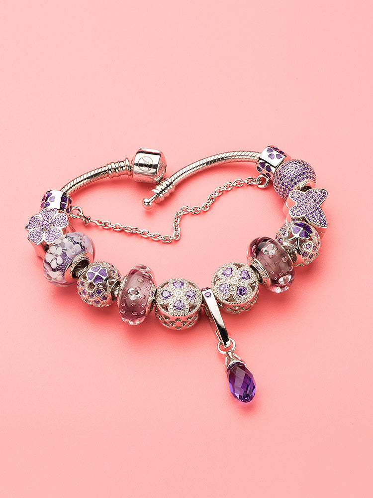 Sterling silver charm bracelet with violet clover charm bead