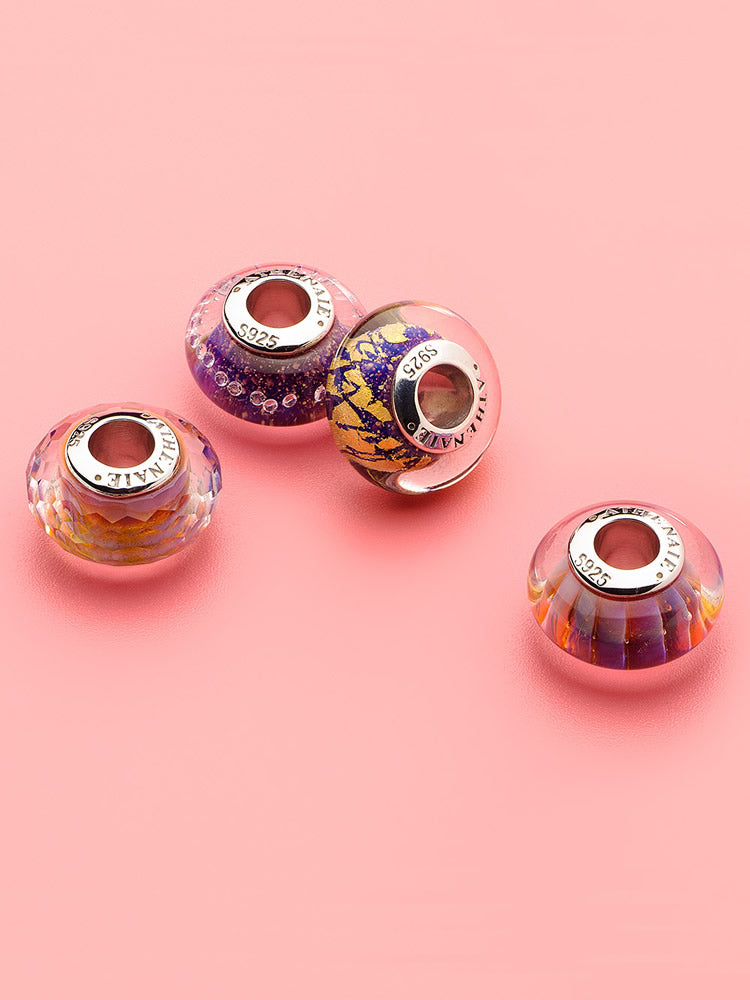 Detail of violet drift murano glass charm on sterling silver bracelet