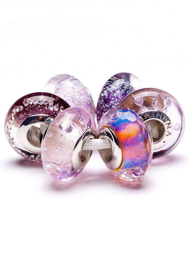 Close view of violet drift murano glass charm on European charm bracelet