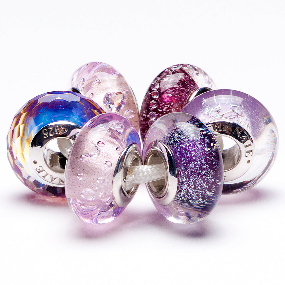 Violet Drift charm with floral background, close-up style