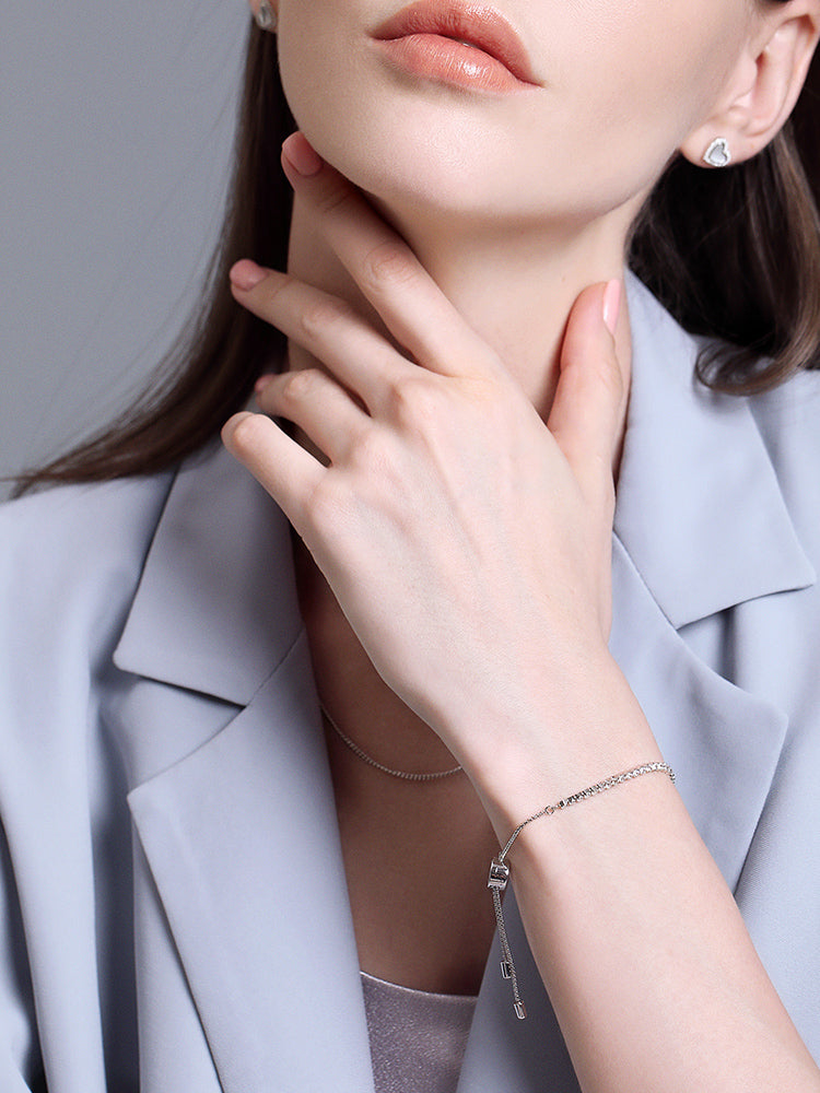 Sterling silver adjustable charm bracelet with white CZ styling