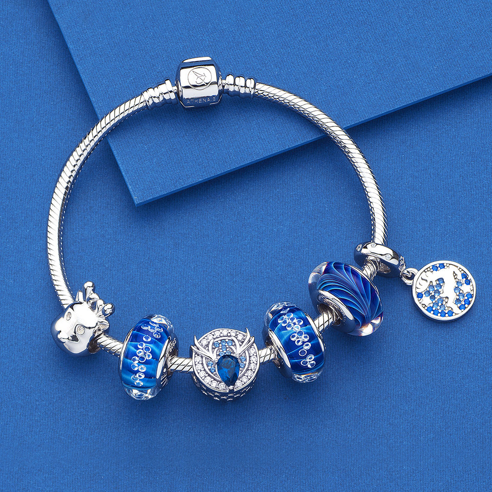 Winter Reindeer pendant charm styled with ATHENAIE bracelet – festive holiday jewelry look