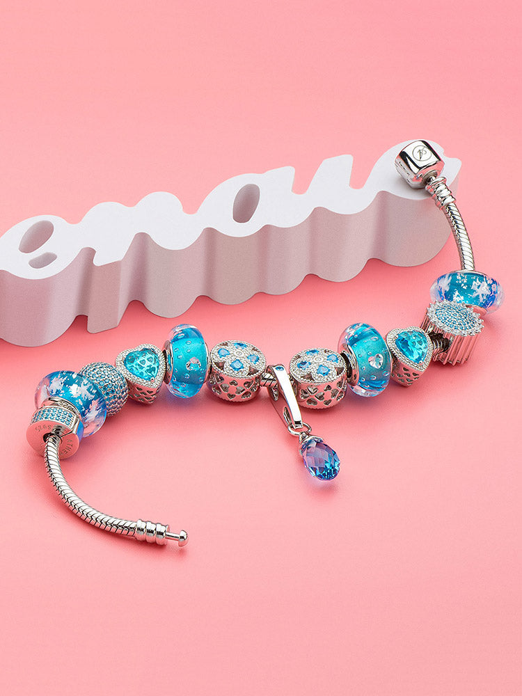 Winter snowflake Murano glass charm bead styled on bracelet