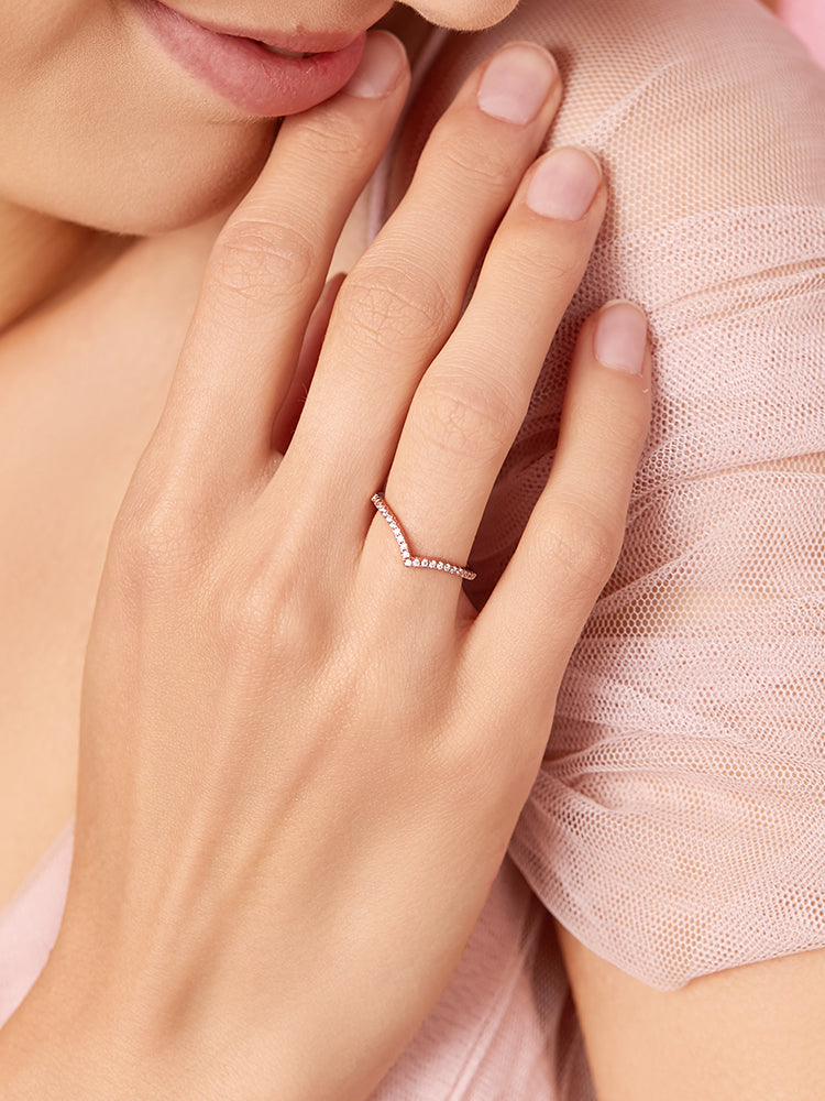 Close up of wishbone ring with CZ stones in sterling silver