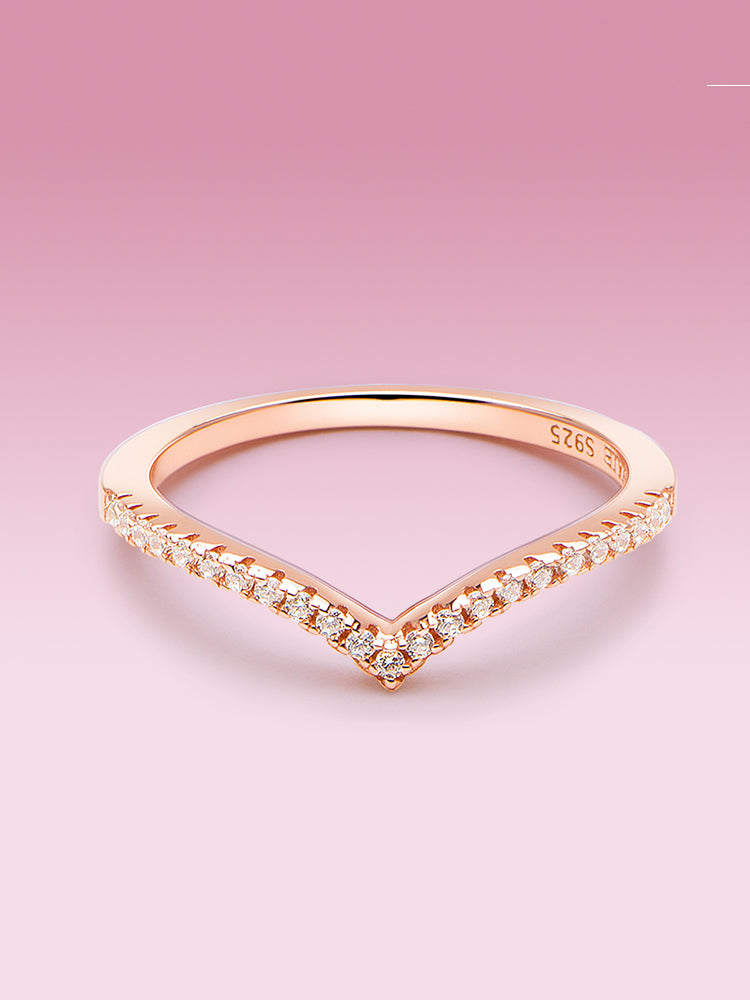 Wishbone ring styled with bracelet and charm jewelry